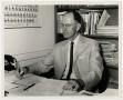 Photograph: [Photograph of Dr. W. Norton Jones, Jr., Grading Papers]