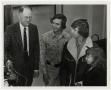 Photograph: [Photograph of Three Students with Professor]