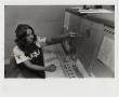 Photograph: [Photograph of Student at Switchboard]
