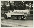 Photograph: [Photograph of Truck in Front of Homes]