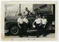 Photograph: [Four Firemen in Front of Engine 9]
