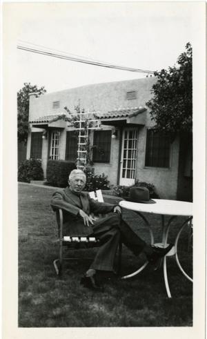 Primary view of object titled '[Photograph of Jesse Sewell in Lawn Chair]'.