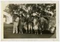 Photograph: [Photograph of Men and Women with Car]