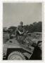 Photograph: [Photograph of Soldier on Armored Car]