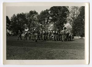 Primary view of object titled '[Photograph of 12th Armored Division Band Marching]'.