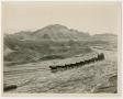 Photograph: [Mule Wagon Passing by Mountains]