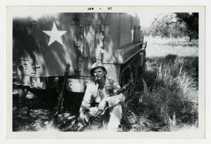 Primary view of object titled '[Photograph of Sergeant Stan Folkman and Half-Track]'.