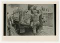 Photograph: [Photograph of Soldier Climbing into Half-Track]