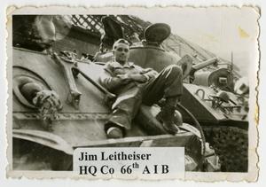 Primary view of object titled '[Jim Leitheiser on His Tank]'.