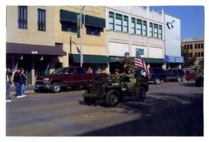Primary view of object titled '[Jeep With Veterans in Dedication Parade]'.