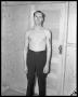 Primary view of Bare chested man standing