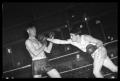 Photograph: [Boxer Hitting Opponent]