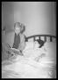 Primary view of [Woman Reading to Girl in Bed]