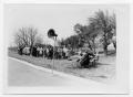 Photograph: [People near a Road and Speaker]