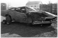 Photograph: [Wrecked Car Being Hauled]