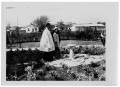 Photograph: [The Johnsons and a Clergyman in a Garden]