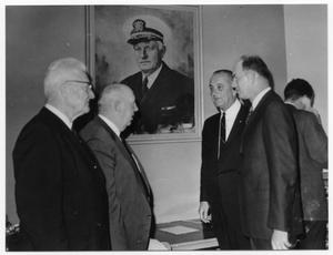 Primary view of object titled '[Lyndon Johnson under a Portrait of Admiral Nimitz]'.