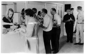 Primary view of object titled '[People Standing in a Cafeteria Line]'.