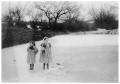 Primary view of [Lucile and Ethel Matthews Standing on a Frozen Pond]