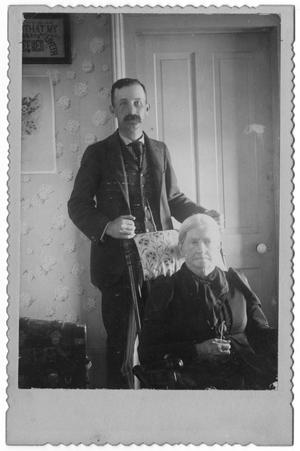 Primary view of object titled '[Mr. Reynolds Standing behind  Seated Anne Maria Reynolds]'.