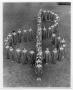Primary view of Choir members posing in formation