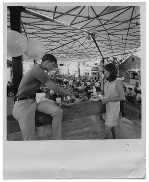 Primary view of object titled 'Young couple eating at HemisFair '68'.