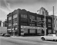 Photograph: [Zoric Garment Dry Cleaning Systems Building, (North oblique)]