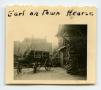 Photograph: [Earl Palmarier Sitting on the Town Hearse]