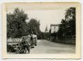 Photograph: [German Soldiers Standing by a Car]