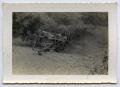 Photograph: [An Overturned Truck in a Ditch]