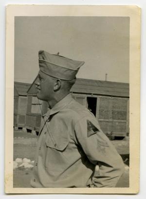 Primary view of object titled '[Photograph of H. Wells in Camp]'.
