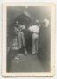 Photograph: [Photograph of Soldiers and Ladies at a Doorway]