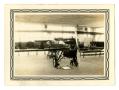 Photograph: [Photograph of an Old Airplane in a Cadet Classroom]