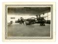 Photograph: [Photograph of Old Airplanes in a Cadet Classroom]
