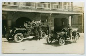 Primary view of object titled '[Postcard of Two Fire Engines in Austin, Texas]'.