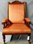 Physical Object: [Eastlake armchair with golden oak frame and orange fabric]