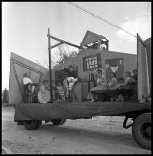 Primary view of object titled '[Parade Float Representing a School House]'.