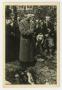 Photograph: [Photograph of a Man Speaking at a Memorial Service]