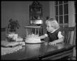 Photograph: [Child Blowing Out Candles]