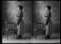 Photograph: [Woman Standing With Chair]