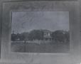 Photograph: [Negative of a two story wooden house]