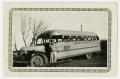 Photograph: [Photograph of a School Bus and Driver]