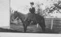 Postcard: [Woman on horseback]