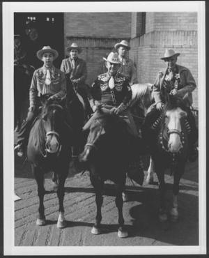 Primary view of object titled '[Group of five men wearing hats and riding horses]'.