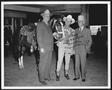 Primary view of [Albert Peyton George, Gene Autry, and Virgil Shepherd standing next to a horse]