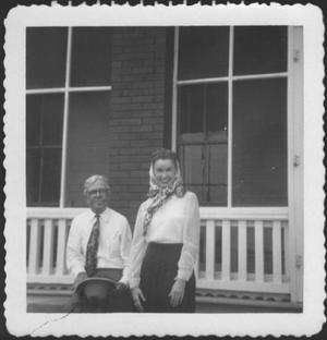 Primary view of object titled '[Mr. Albert George and Ruth Forsgard in front of the ranch house porch]'.