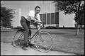 Photograph: [Photograph of Bill Ballard on Bicycle]