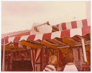 Primary view of object titled '[Broken Sky Tram Car On Top of Carnival Tent]'.