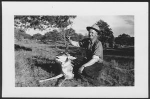 Primary view of object titled '[Photograph of S. Omar Barker at Adobe Ranch posing with the deer he killed in a hunt]'.