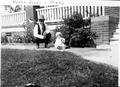 Photograph: [Photograph of Henry Jones squatting beside infant Mary Jones]